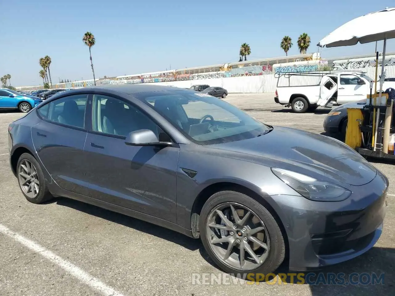 4 Photograph of a damaged car 5YJ3E1EB7NF277493 TESLA MODEL 3 2022