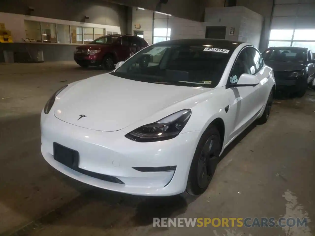 2 Photograph of a damaged car 5YJ3E1EB8NF107403 TESLA MODEL 3 2022