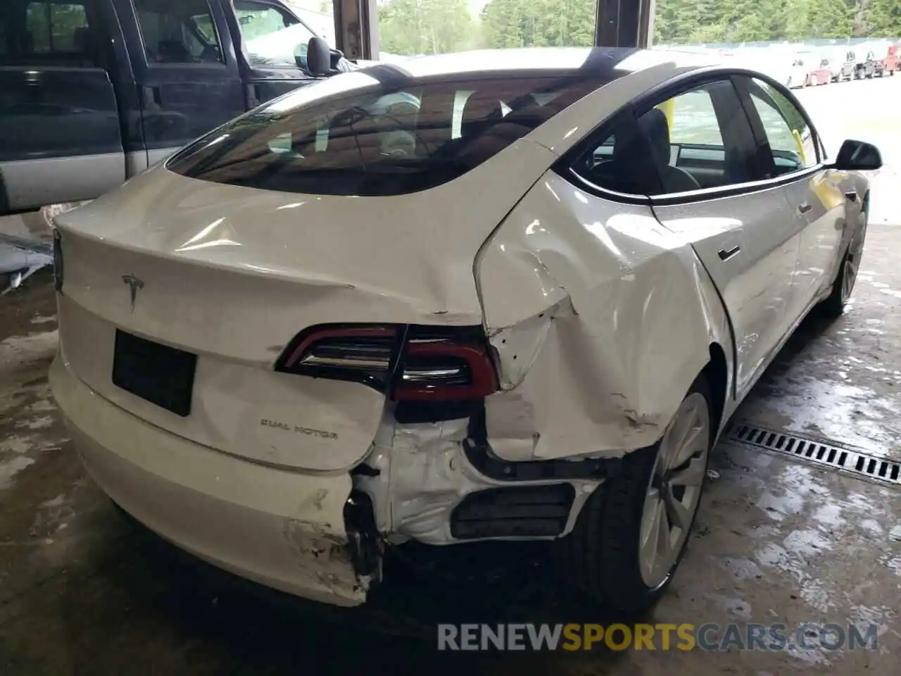 4 Photograph of a damaged car 5YJ3E1EB8NF128140 TESLA MODEL 3 2022