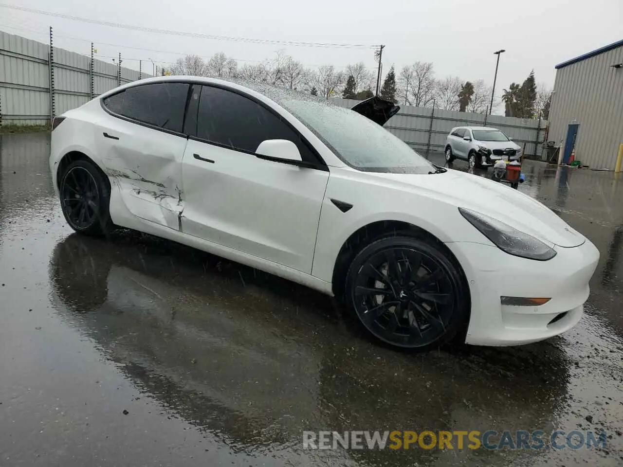 4 Photograph of a damaged car 5YJ3E1EB8NF144421 TESLA MODEL 3 2022