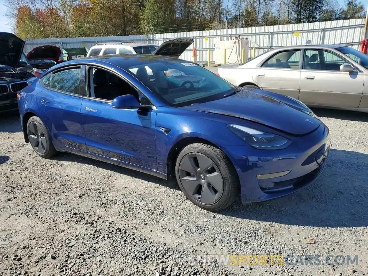 4 Photograph of a damaged car 5YJ3E1EB8NF273601 TESLA MODEL 3 2022