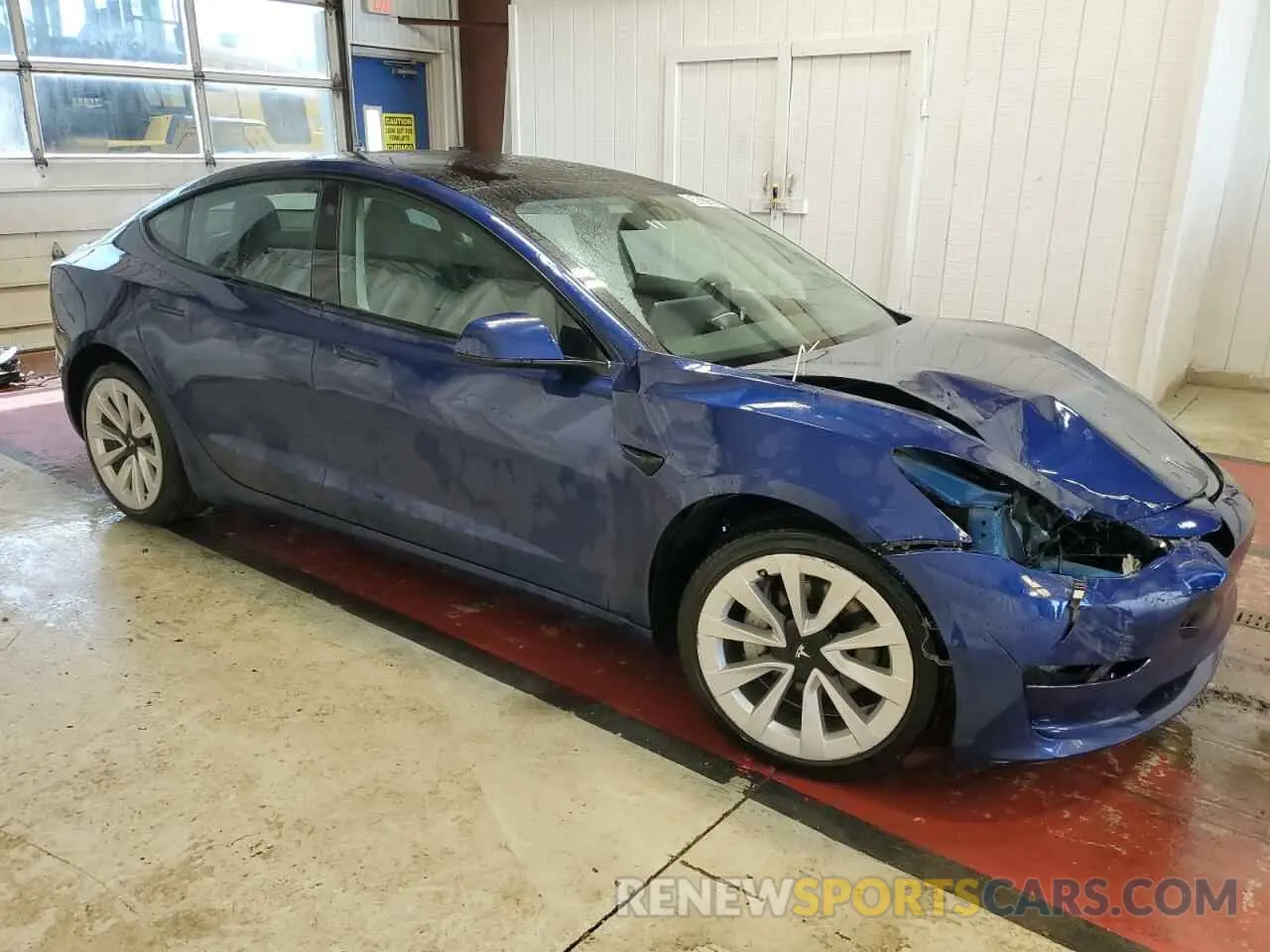 4 Photograph of a damaged car 5YJ3E1EB8NF305110 TESLA MODEL 3 2022
