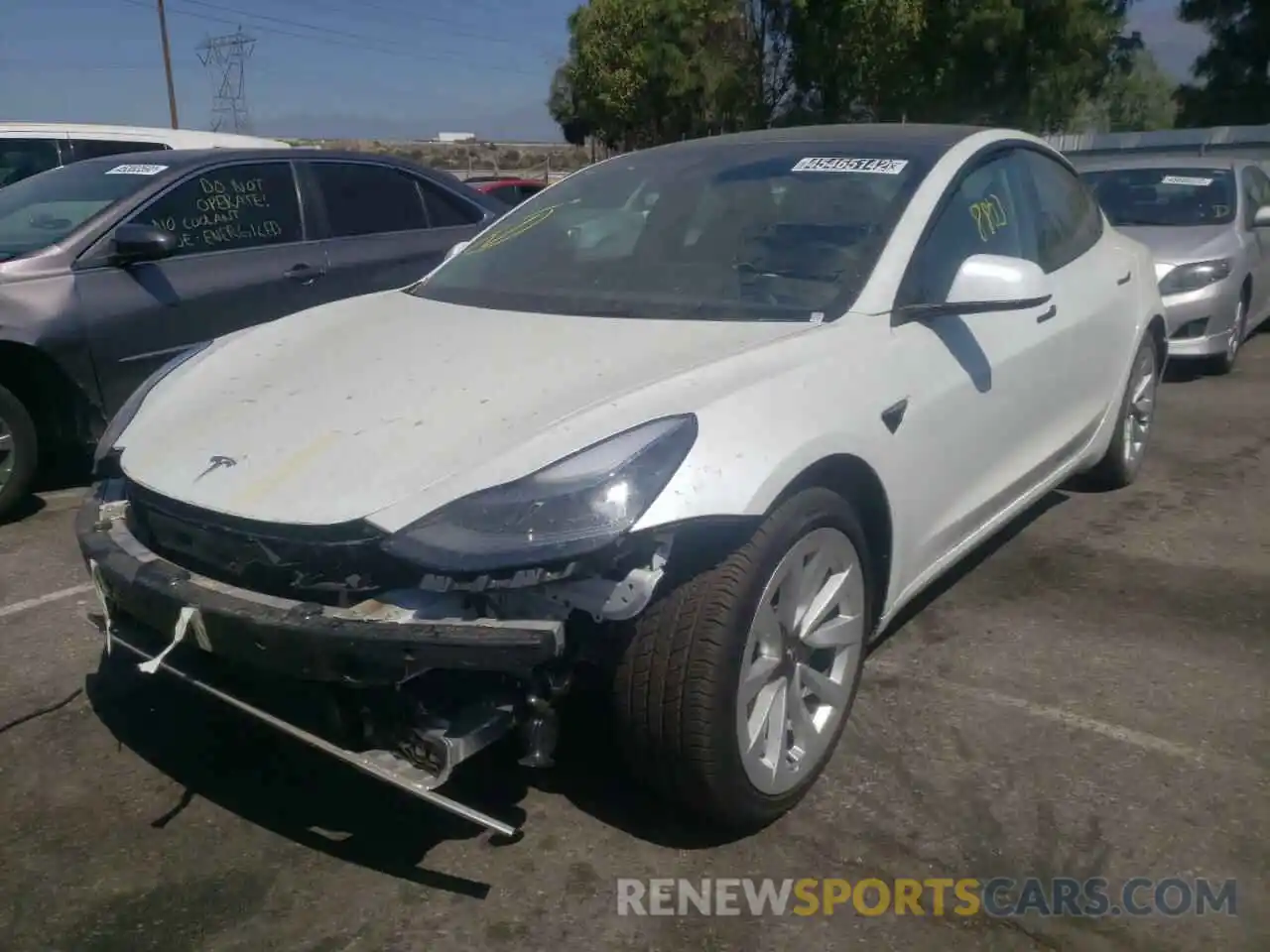 2 Photograph of a damaged car 5YJ3E1EB9NF144654 TESLA MODEL 3 2022