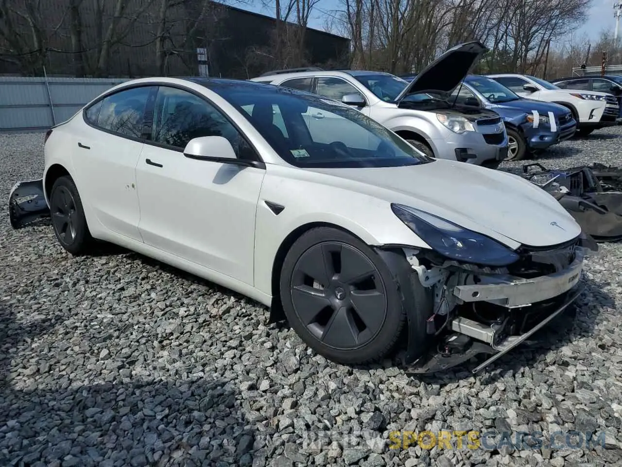 4 Photograph of a damaged car 5YJ3E1EB9NF159977 TESLA MODEL 3 2022
