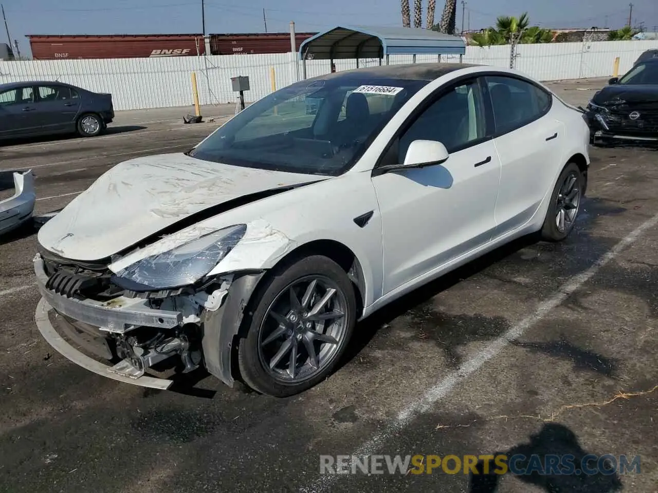 1 Photograph of a damaged car 5YJ3E1EB9NF173779 TESLA MODEL 3 2022