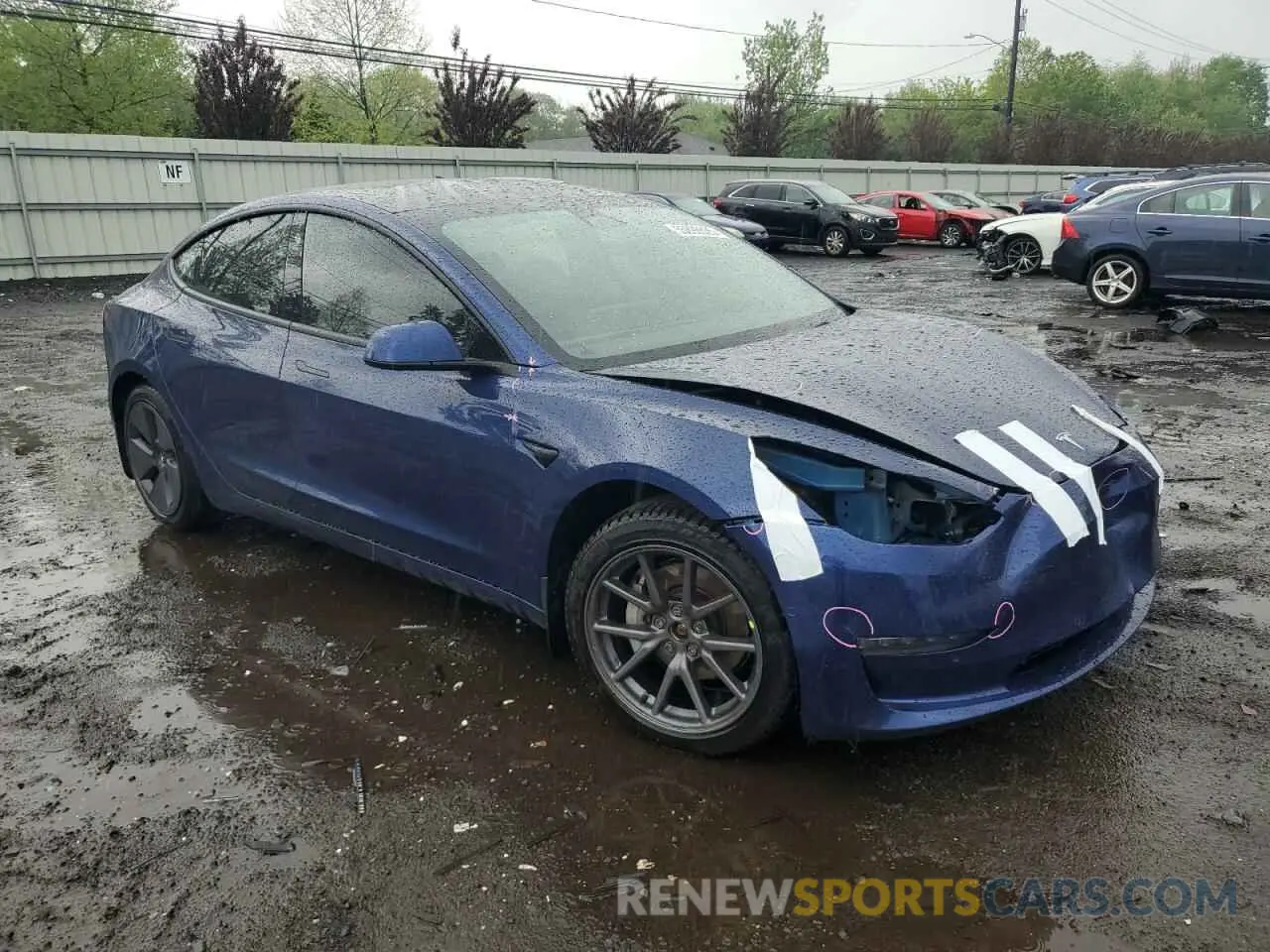 4 Photograph of a damaged car 5YJ3E1EB9NF232474 TESLA MODEL 3 2022