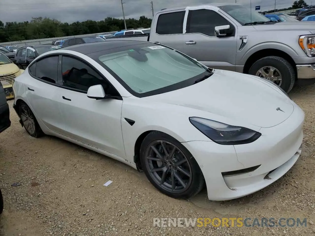 4 Photograph of a damaged car 5YJ3E1EB9NF325799 TESLA MODEL 3 2022