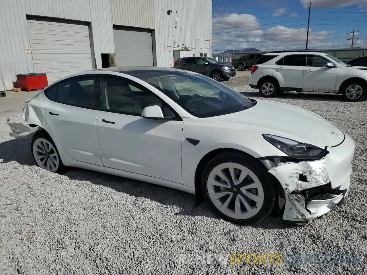 4 Photograph of a damaged car 5YJ3E1EB9NF328413 TESLA MODEL 3 2022