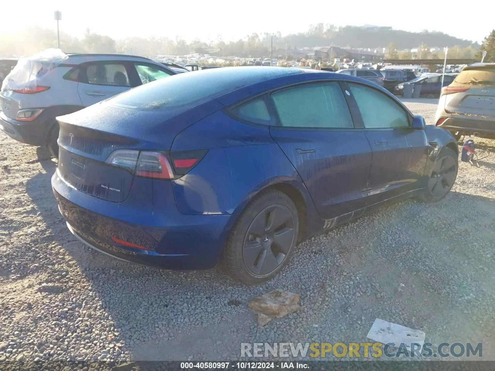 4 Photograph of a damaged car 5YJ3E1EBXNF192714 TESLA MODEL 3 2022