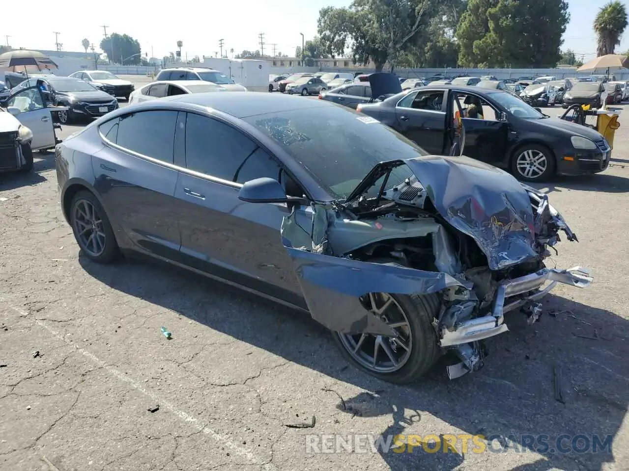 4 Photograph of a damaged car 5YJ3E1EBXNF267671 TESLA MODEL 3 2022
