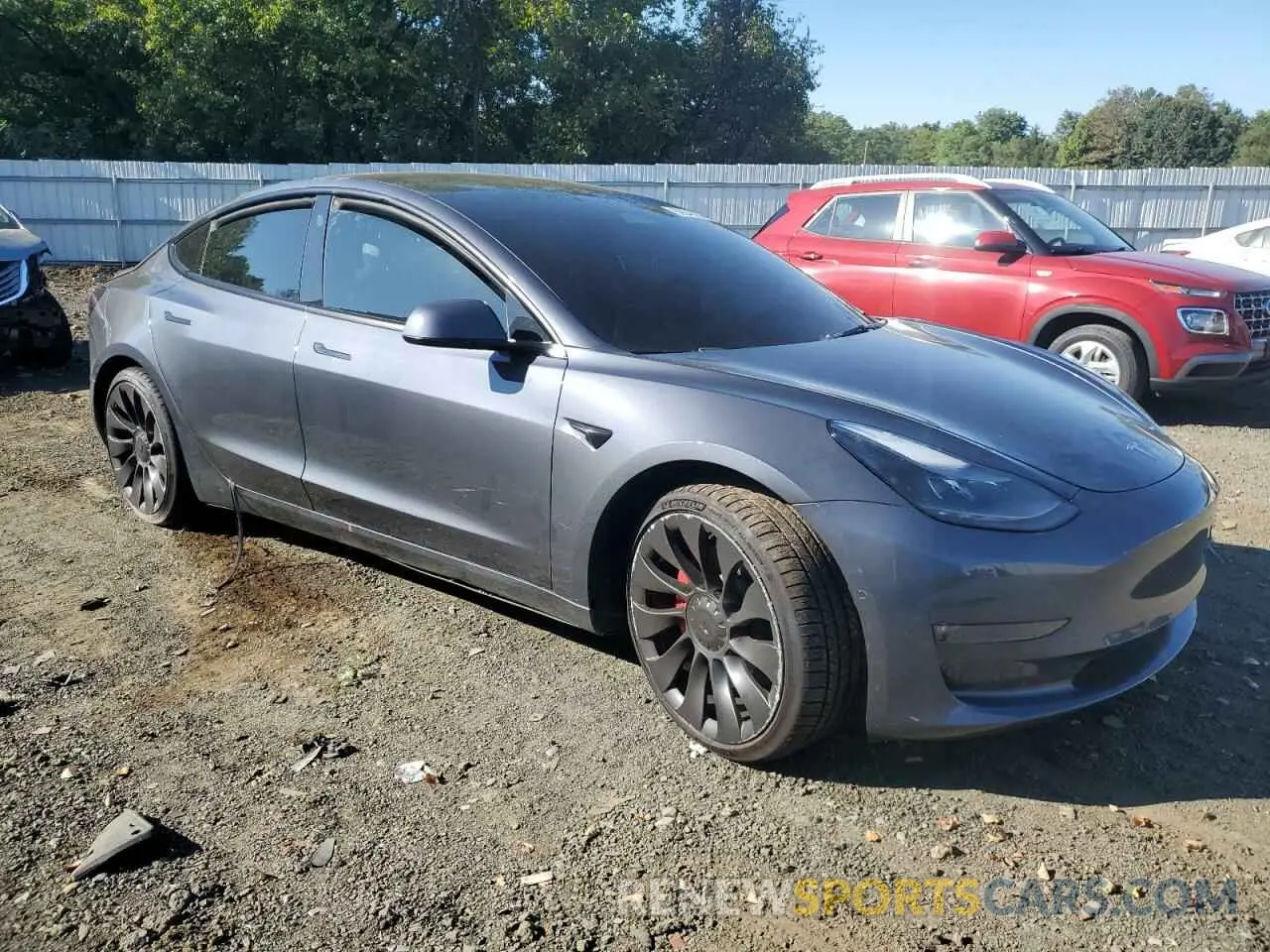 4 Photograph of a damaged car 5YJ3E1EC2NF261811 TESLA MODEL 3 2022
