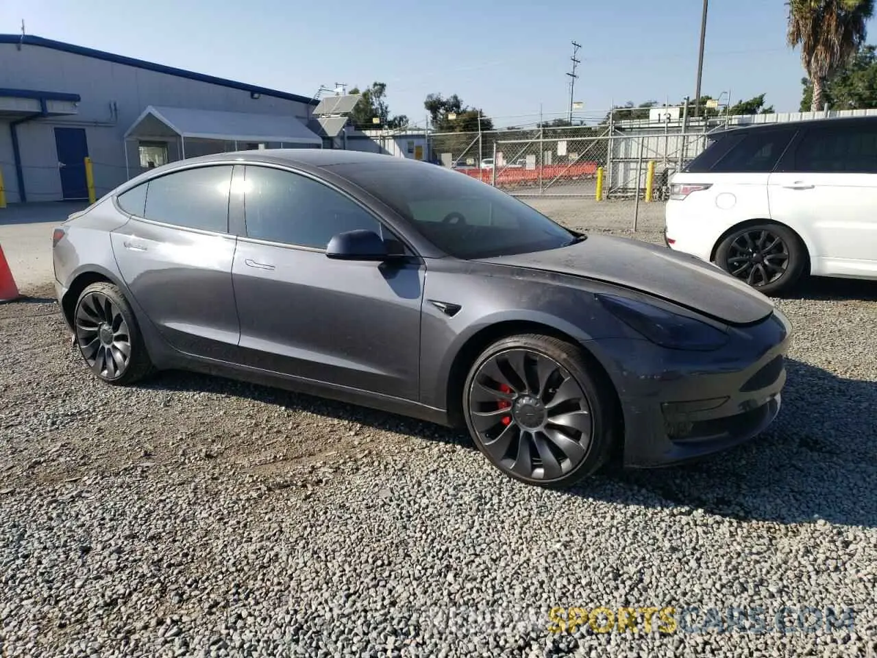 4 Photograph of a damaged car 5YJ3E1EC3NF210351 TESLA MODEL 3 2022