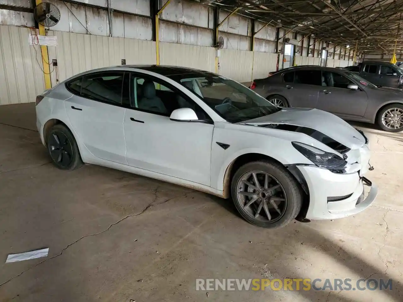 4 Photograph of a damaged car 5YJ3E1EA0PF493597 TESLA MODEL 3 2023