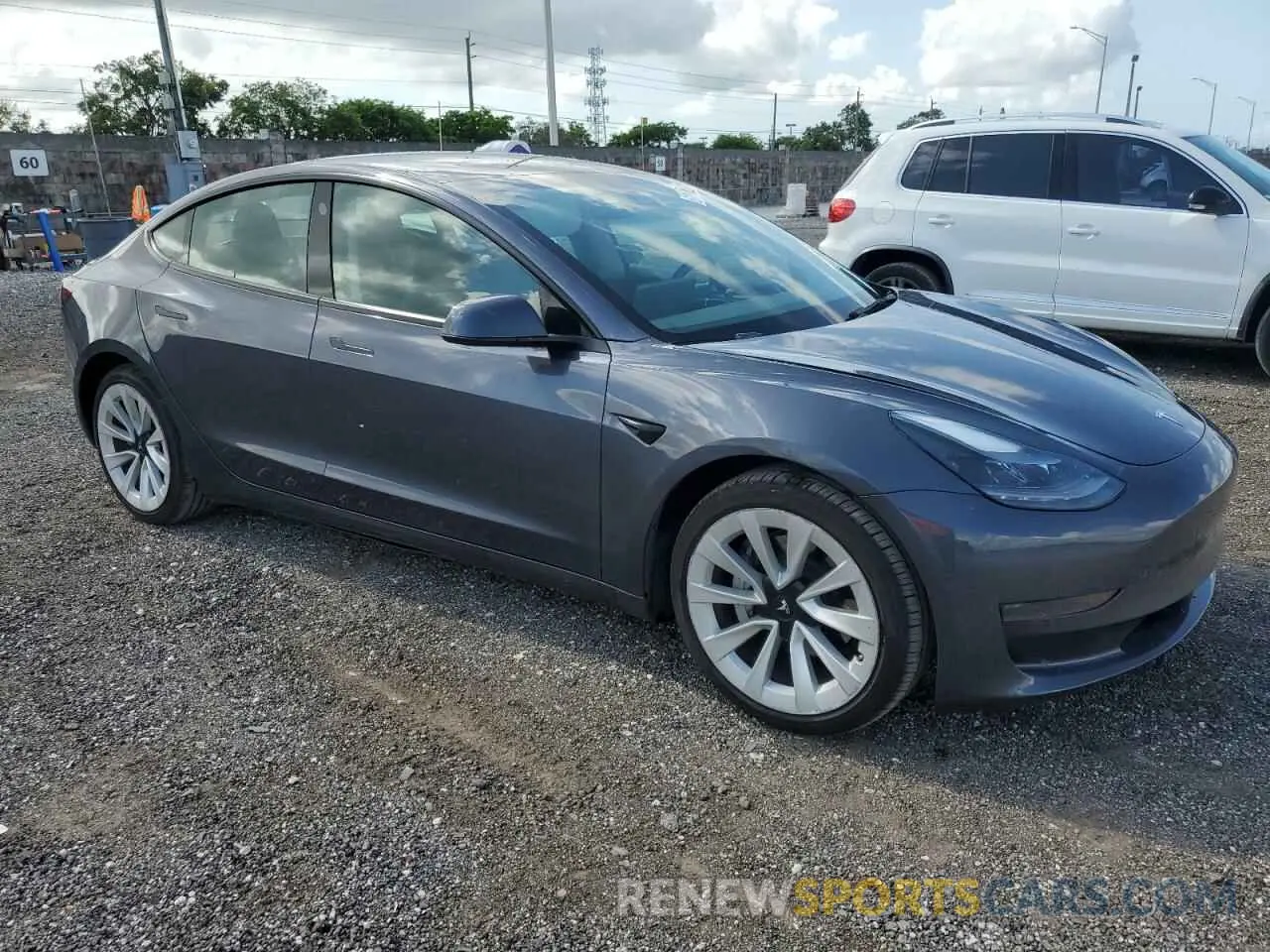 4 Photograph of a damaged car 5YJ3E1EA1PF449950 TESLA MODEL 3 2023
