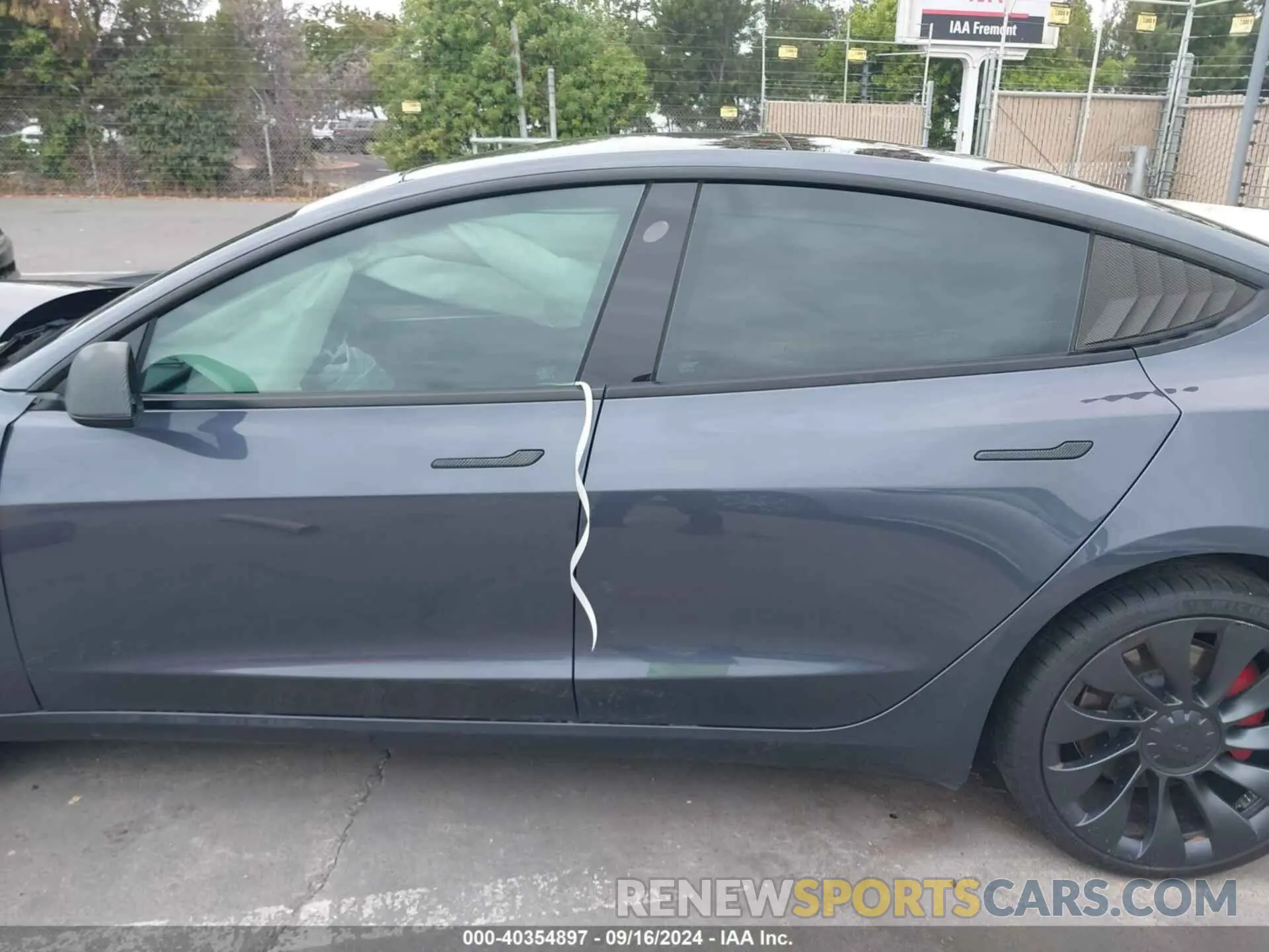 13 Photograph of a damaged car 5YJ3E1EC0PF498784 TESLA MODEL 3 2023