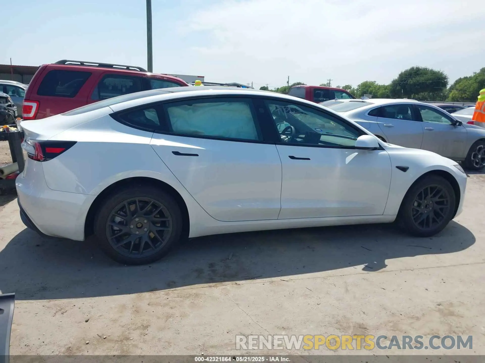 14 Photograph of a damaged car 5YJ3E1EAXRF785907 TESLA MODEL 3 2024