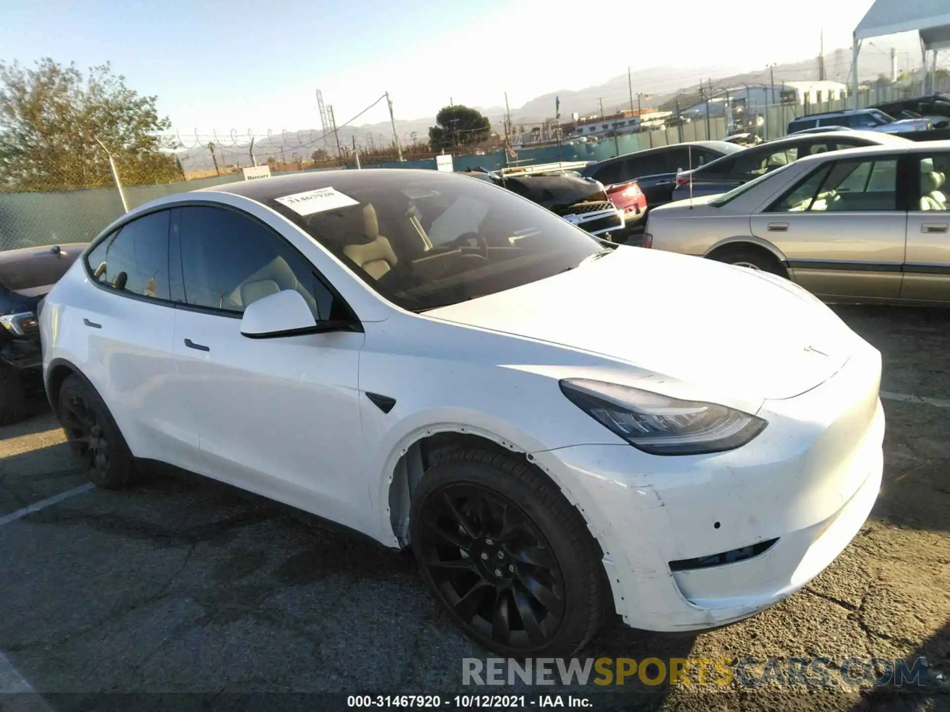 1 Photograph of a damaged car 5YJYGAEEXMF218477 TESLA MODEL Y 2021