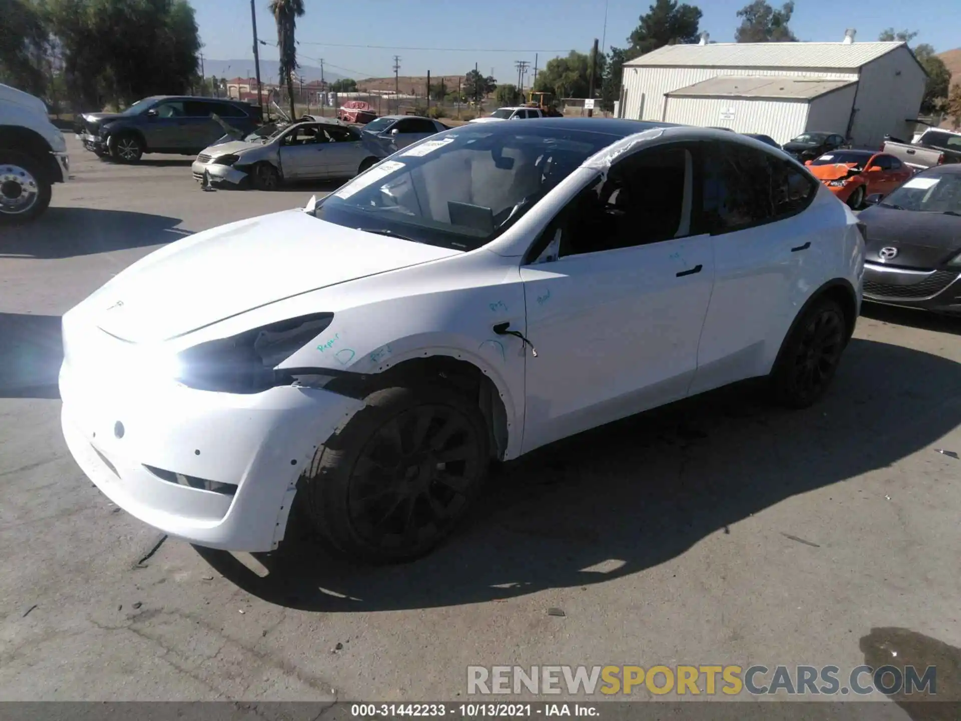 2 Photograph of a damaged car 5YJYGDEE8MF216860 TESLA MODEL Y 2021