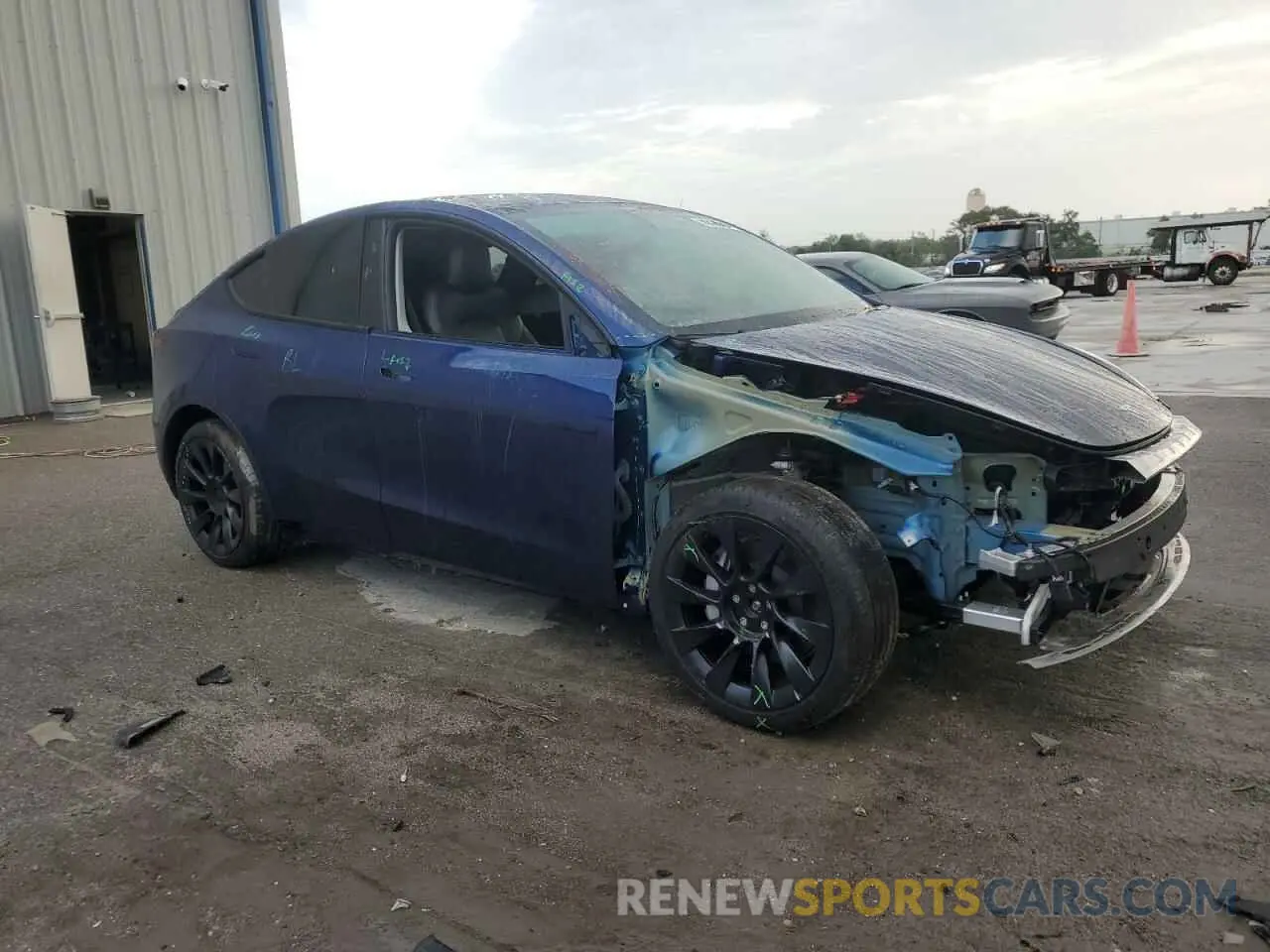 4 Photograph of a damaged car 7SAYGAEE3PF842256 TESLA MODEL Y 2023