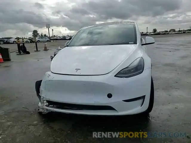 11 Photograph of a damaged car 7SAYGAEE5PF743079 TESLA MODEL Y 2023