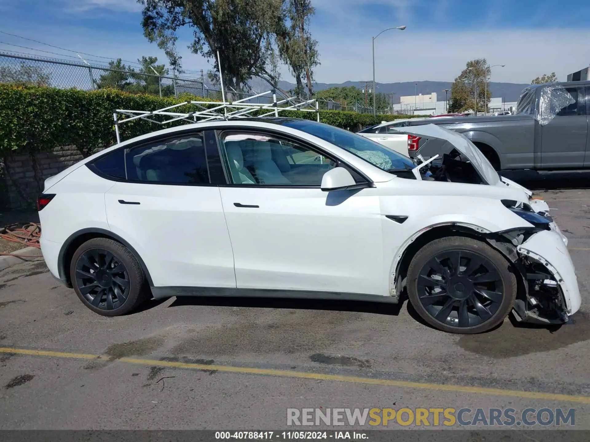 13 Photograph of a damaged car 7SAYGAEE6PF662625 TESLA MODEL Y 2023