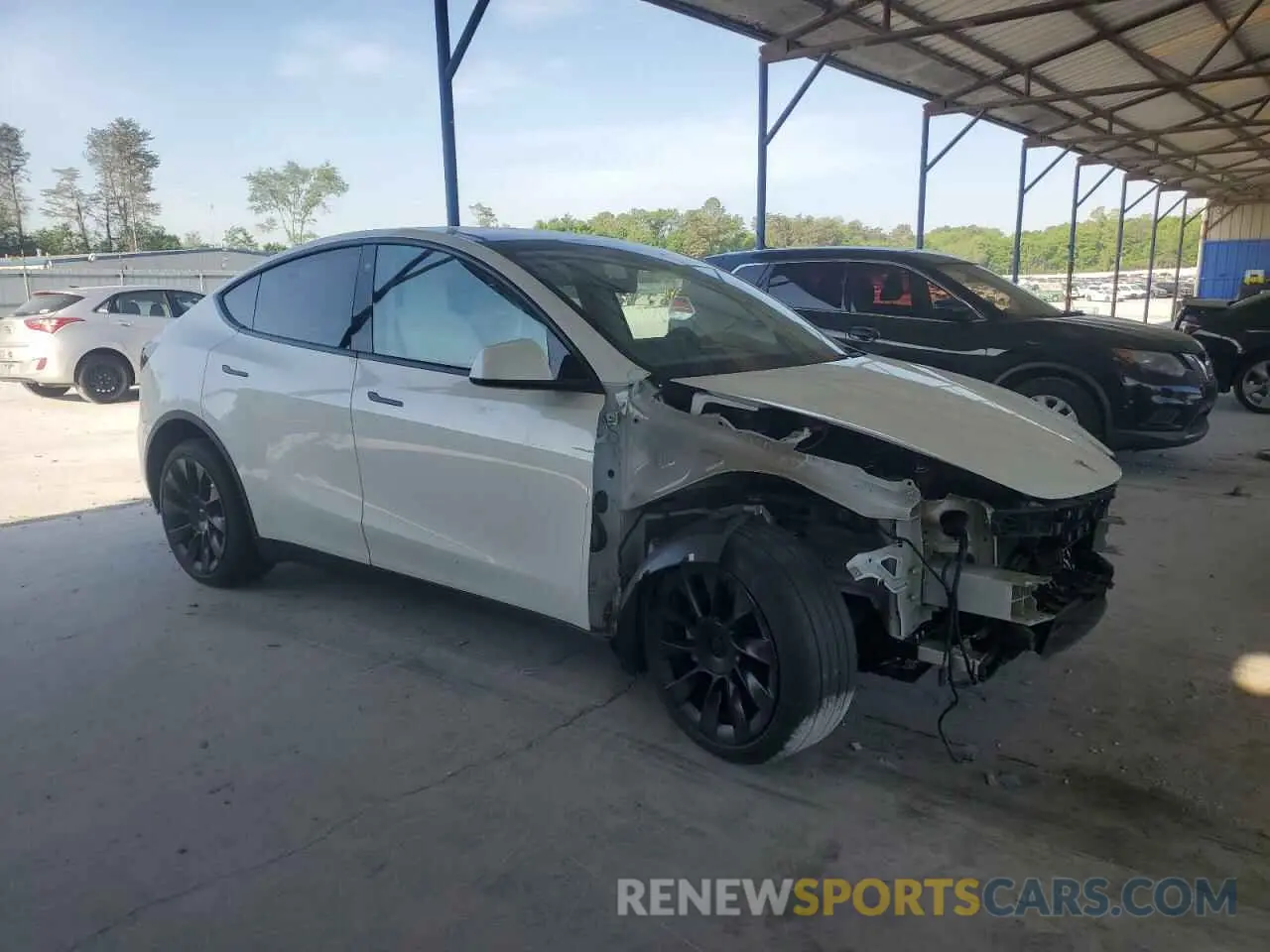 4 Photograph of a damaged car 7SAYGDEE7PF614925 TESLA MODEL Y 2023