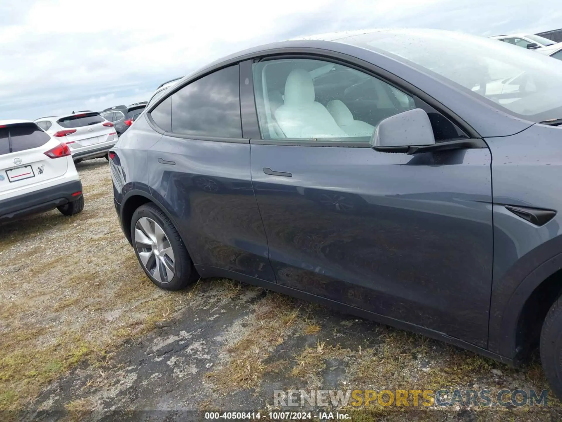 12 Photograph of a damaged car 7SAYGDEE9PA180410 TESLA MODEL Y 2023