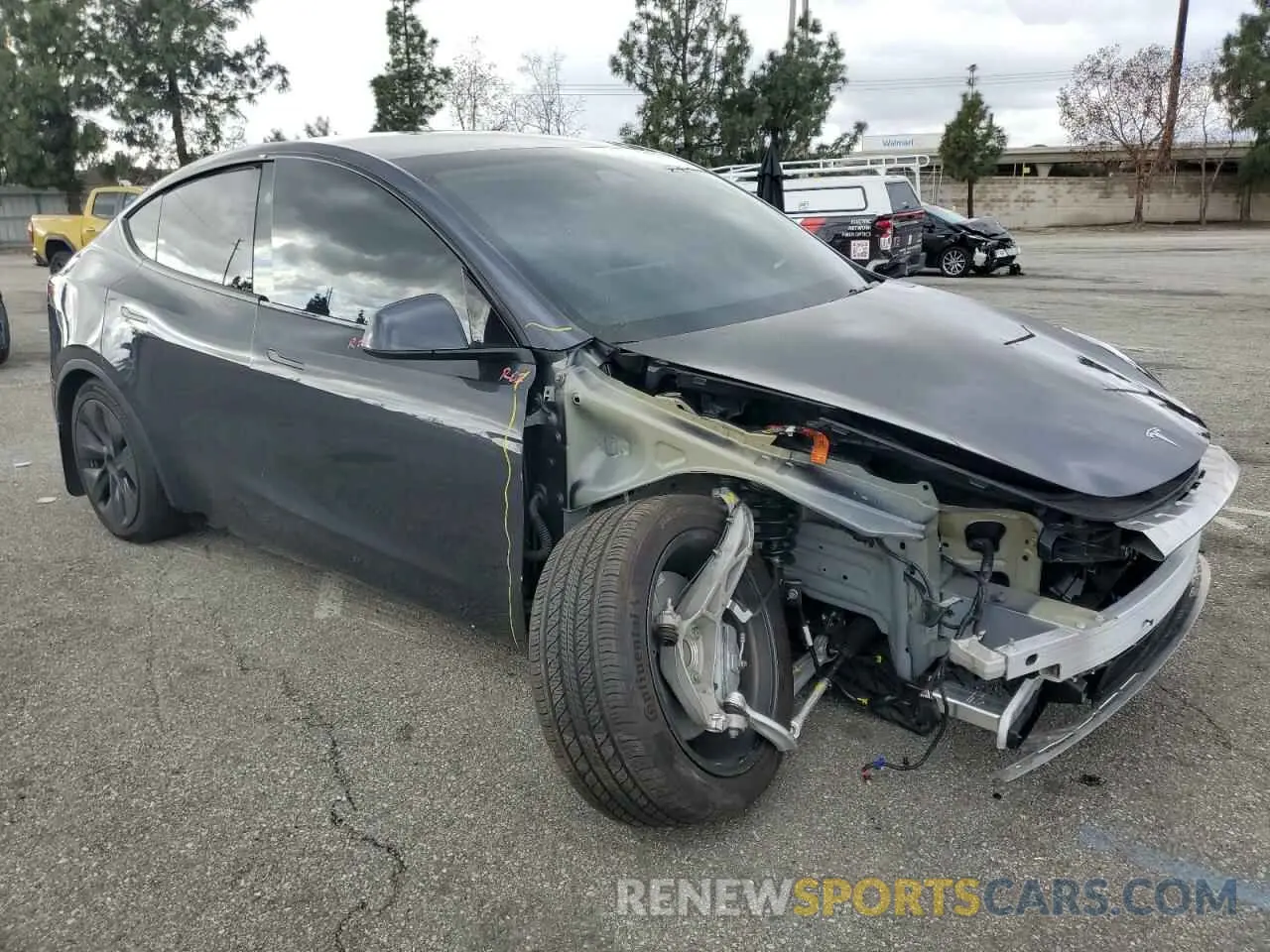 4 Photograph of a damaged car 7SAYGDED0RF111859 TESLA MODEL Y 2024