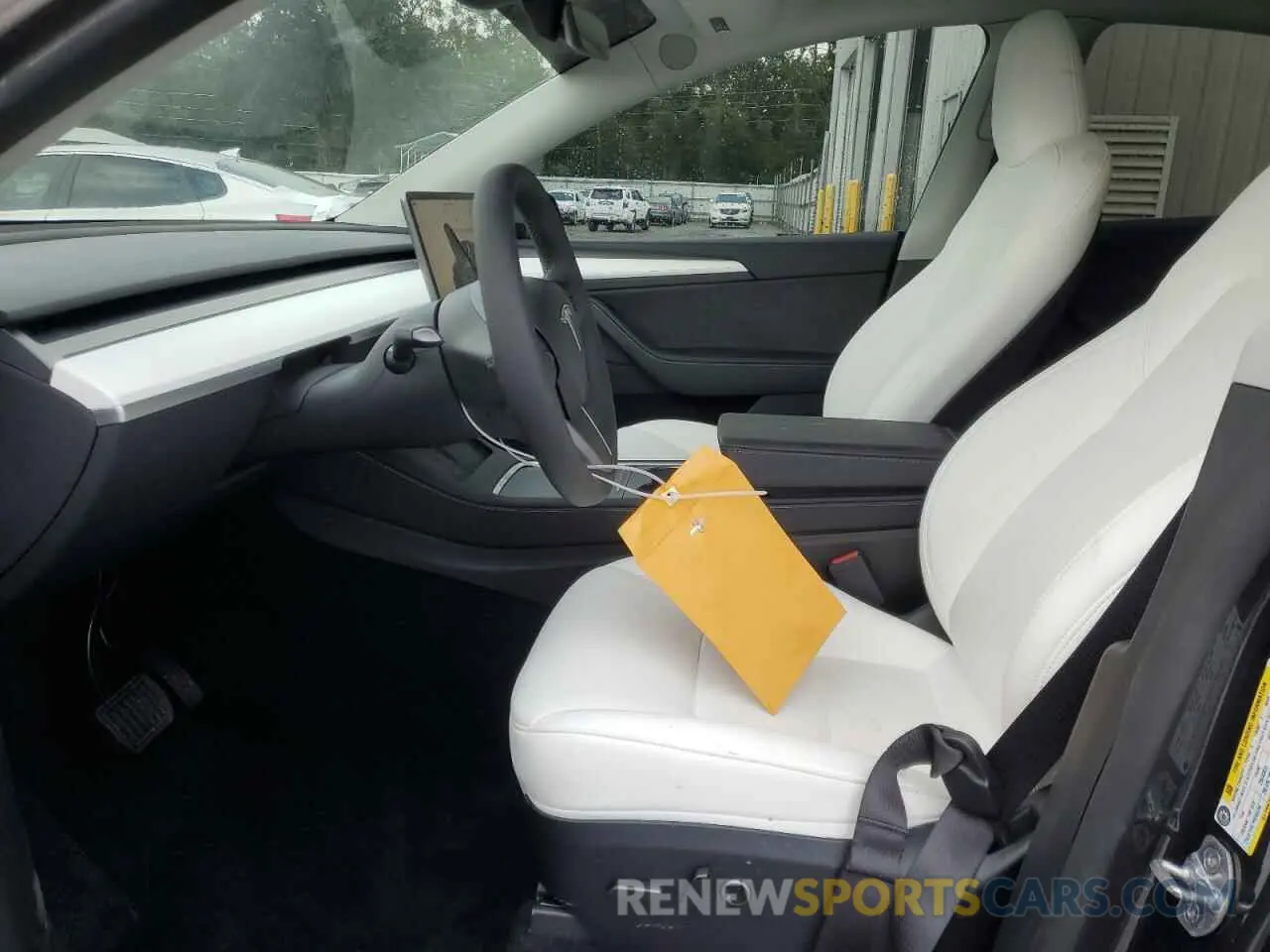 7 Photograph of a damaged car 7SAYGDED1RA303983 TESLA MODEL Y 2024