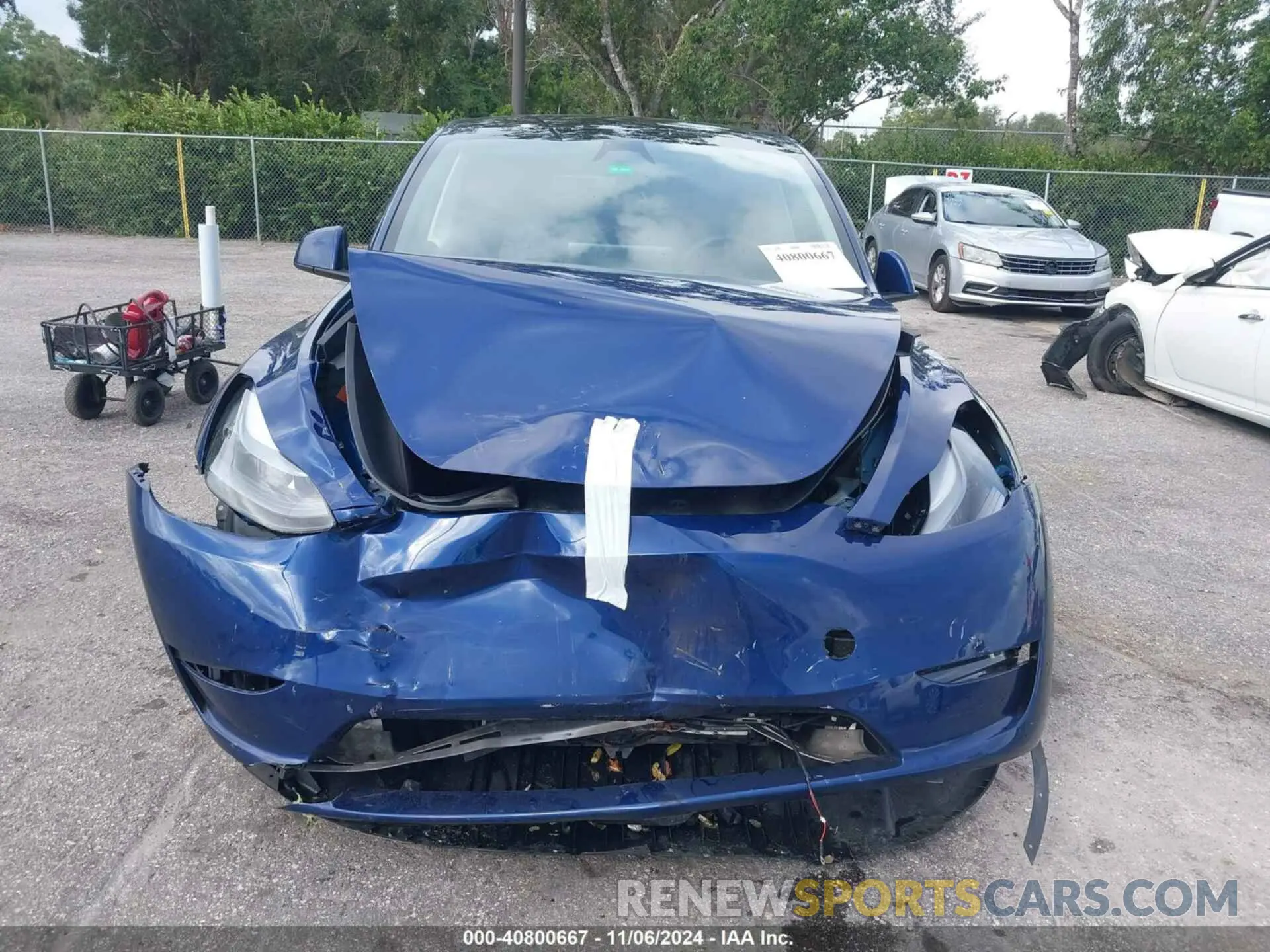 12 Photograph of a damaged car 7SAYGDED3RF032671 TESLA MODEL Y 2024