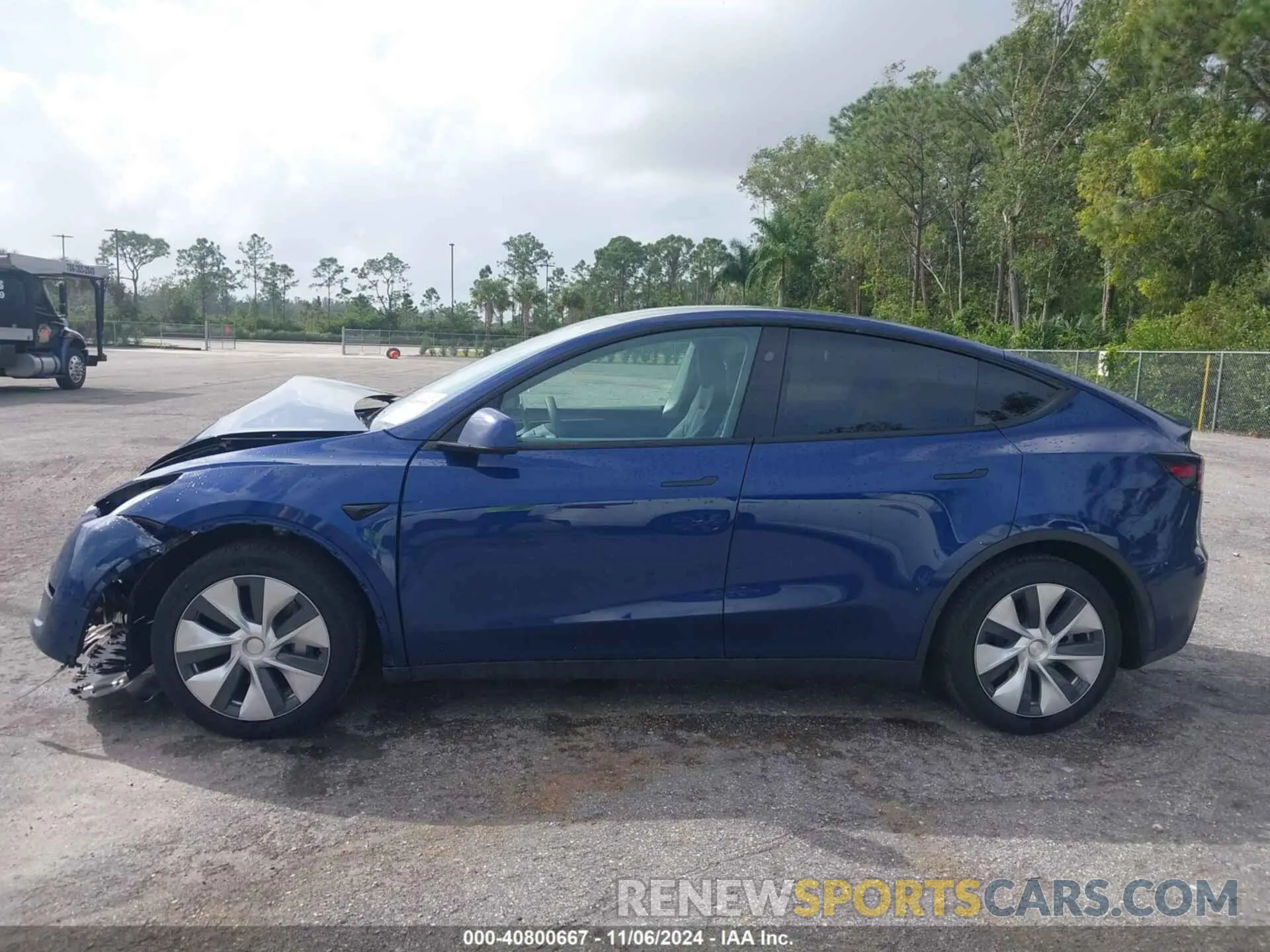 14 Photograph of a damaged car 7SAYGDED3RF032671 TESLA MODEL Y 2024