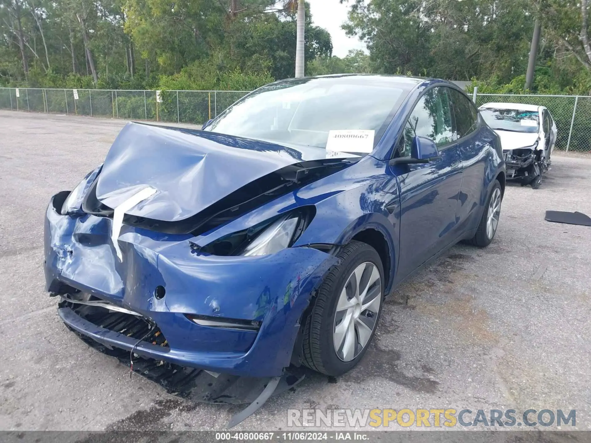 2 Photograph of a damaged car 7SAYGDED3RF032671 TESLA MODEL Y 2024