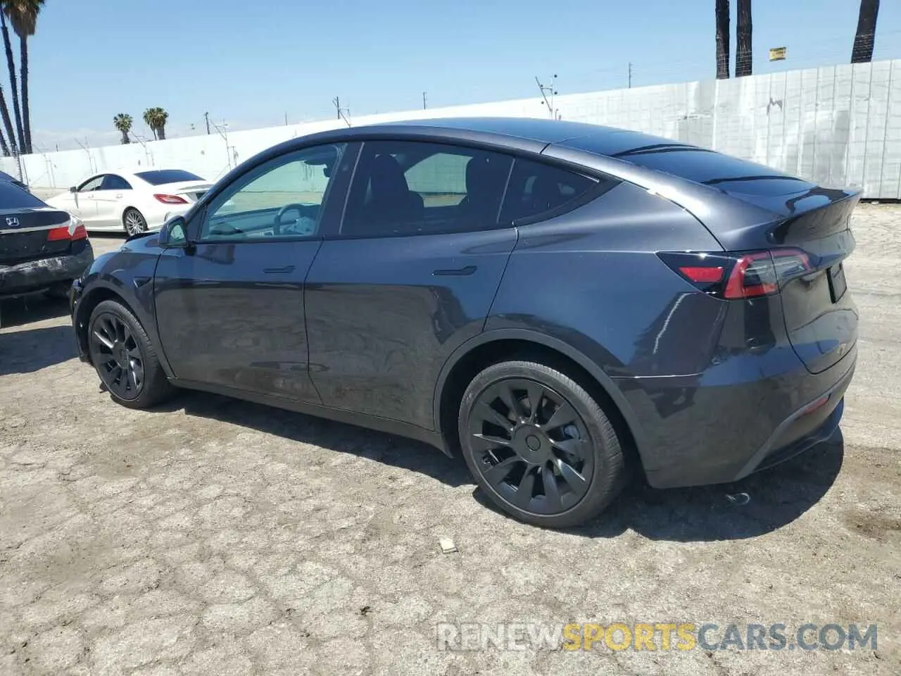 2 Photograph of a damaged car 7SAYGDED3RF056131 TESLA MODEL Y 2024