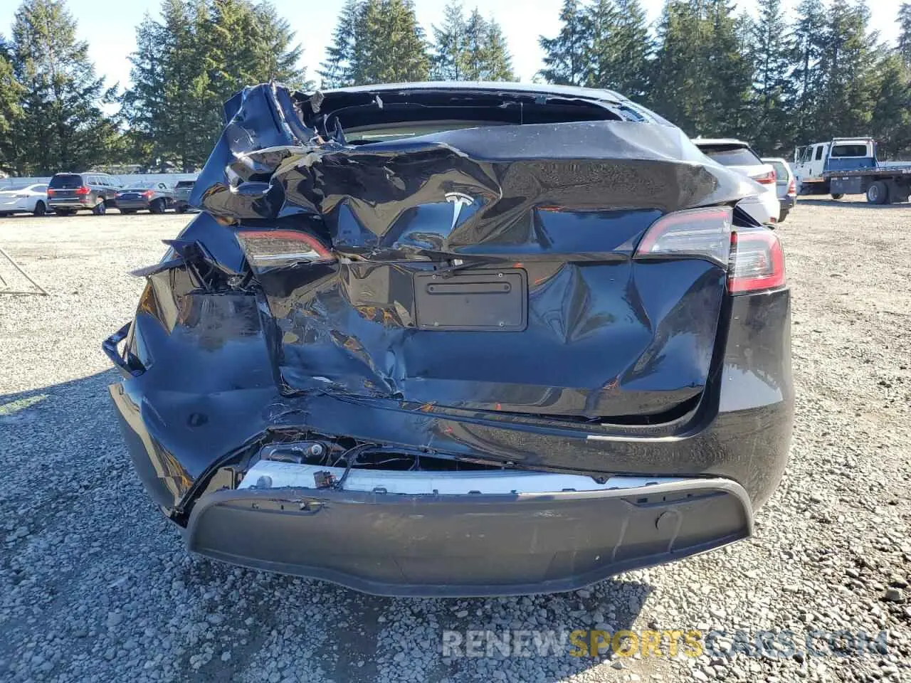 6 Photograph of a damaged car 7SAYGDED3RF151577 TESLA MODEL Y 2024