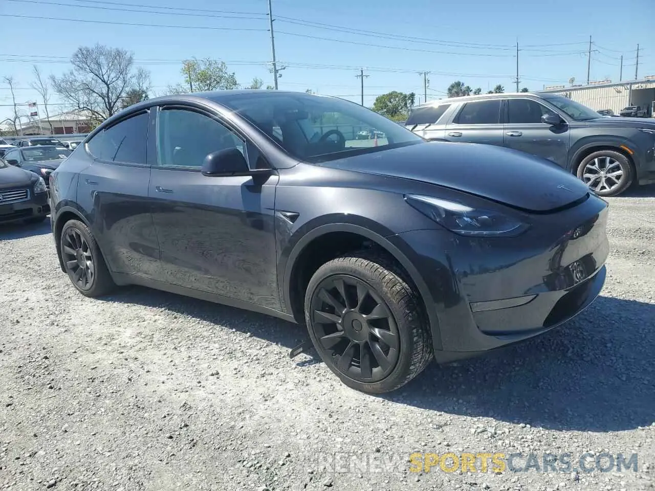 4 Photograph of a damaged car 7SAYGDED3RF177273 TESLA MODEL Y 2024
