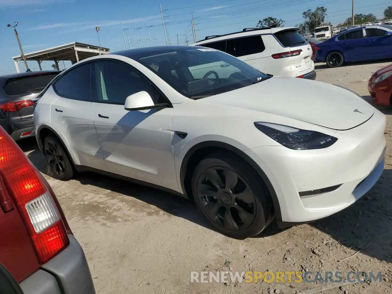 4 Photograph of a damaged car 7SAYGDED5RF044398 TESLA MODEL Y 2024