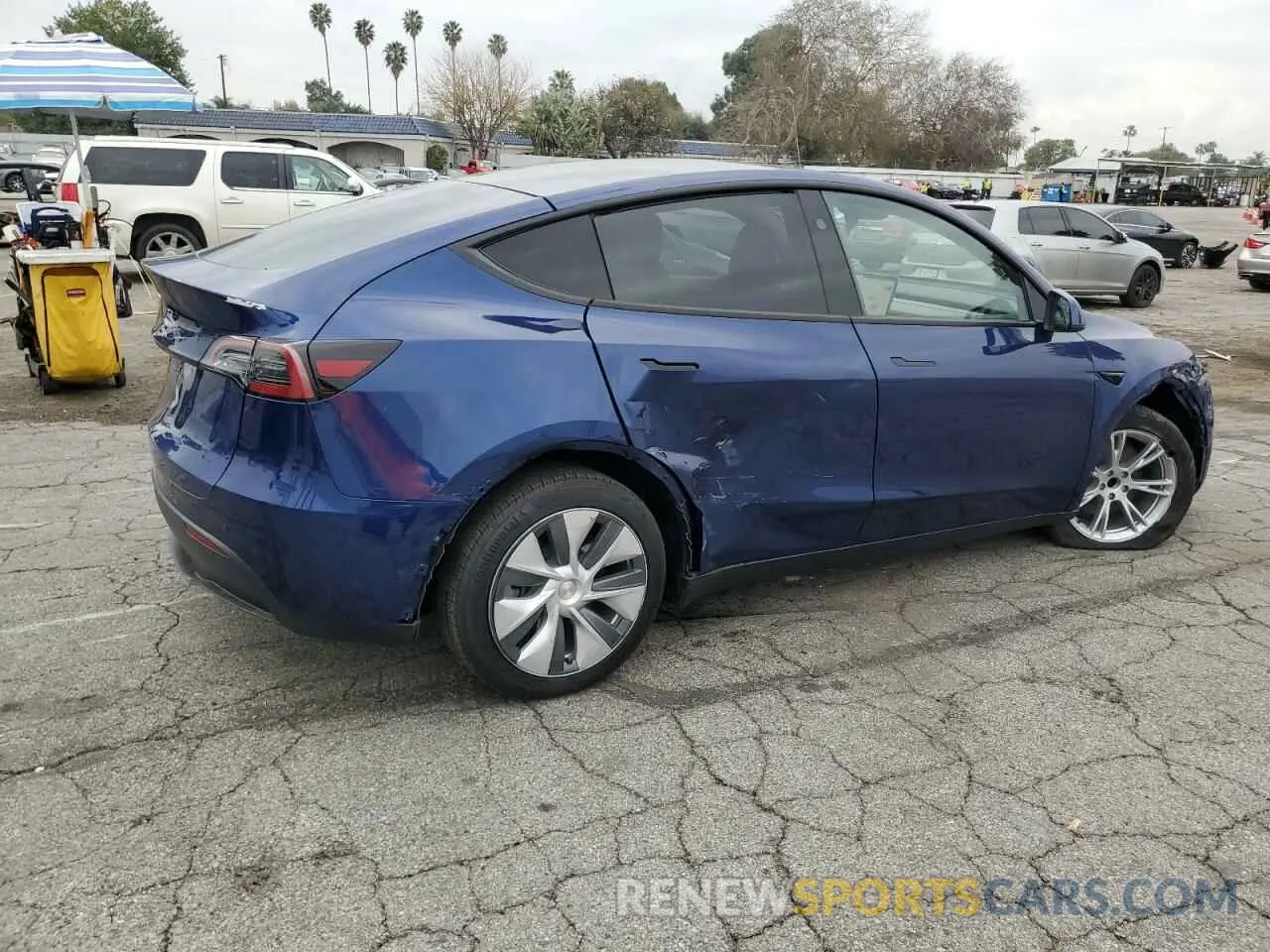 3 Photograph of a damaged car 7SAYGDED5RF082102 TESLA MODEL Y 2024