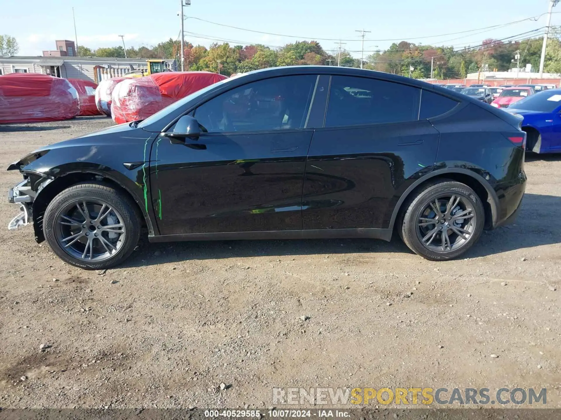 14 Photograph of a damaged car 7SAYGDED5RF130214 TESLA MODEL Y 2024