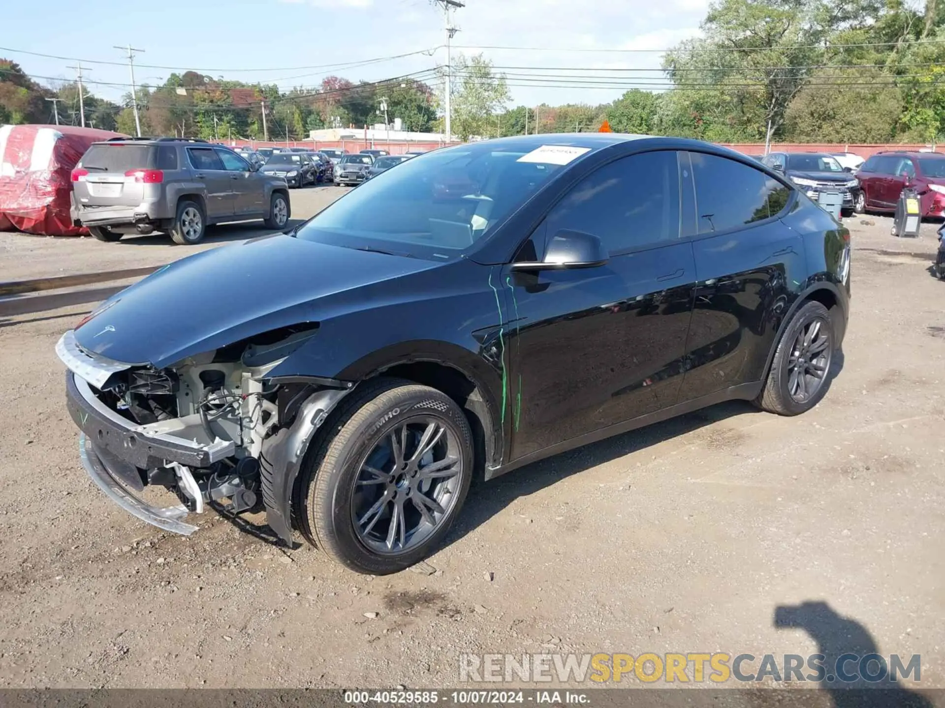 2 Photograph of a damaged car 7SAYGDED5RF130214 TESLA MODEL Y 2024