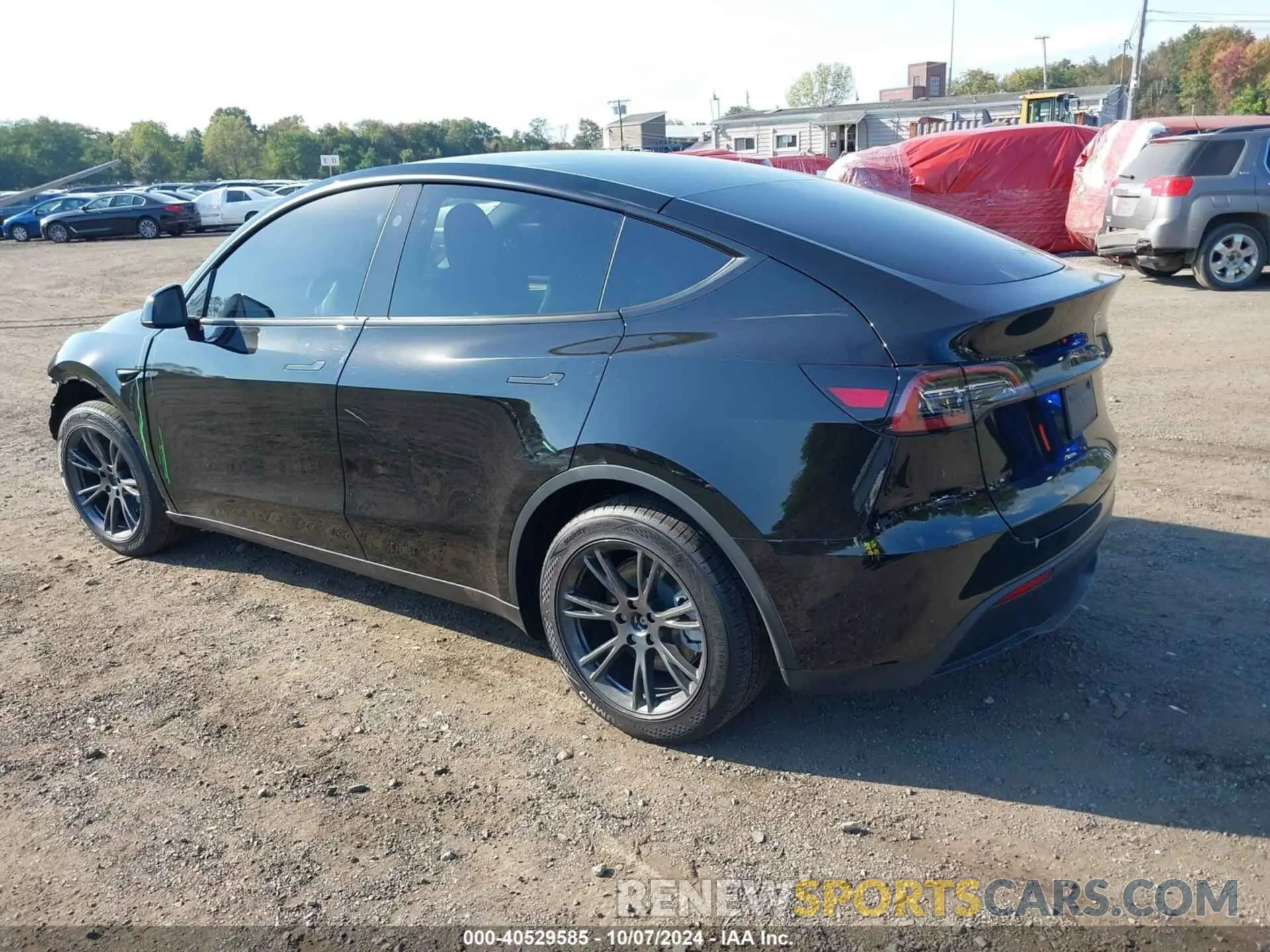 3 Photograph of a damaged car 7SAYGDED5RF130214 TESLA MODEL Y 2024