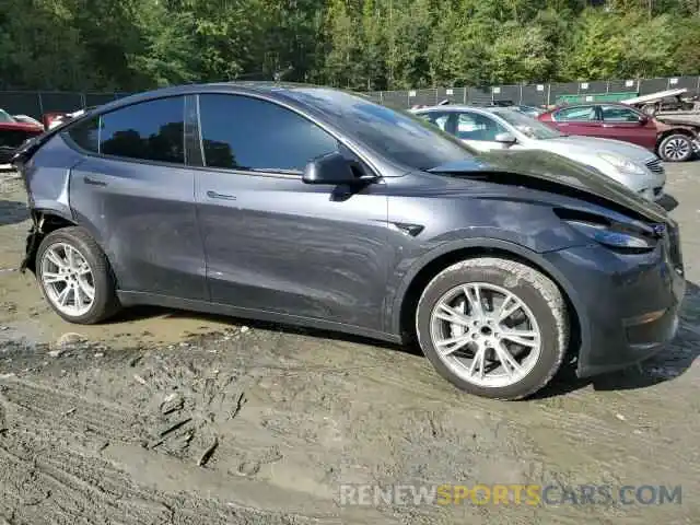 4 Photograph of a damaged car 7SAYGDED6RF091911 TESLA MODEL Y 2024