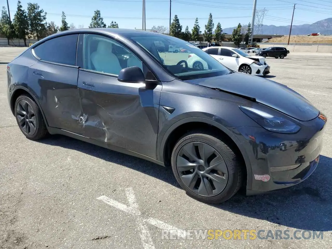 4 Photograph of a damaged car 7SAYGDED7RF199485 TESLA MODEL Y 2024