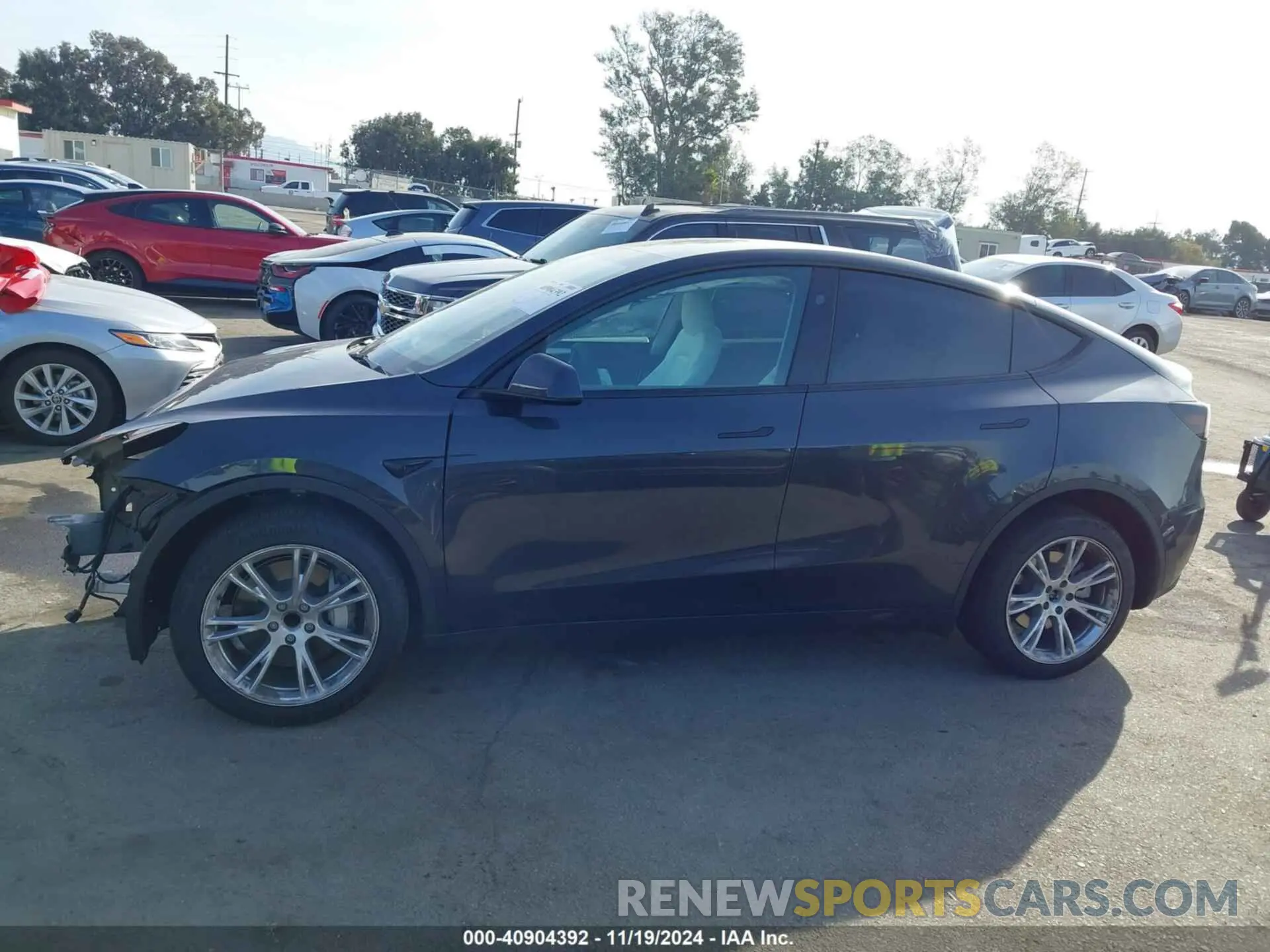 14 Photograph of a damaged car 7SAYGDED8RF008642 TESLA MODEL Y 2024
