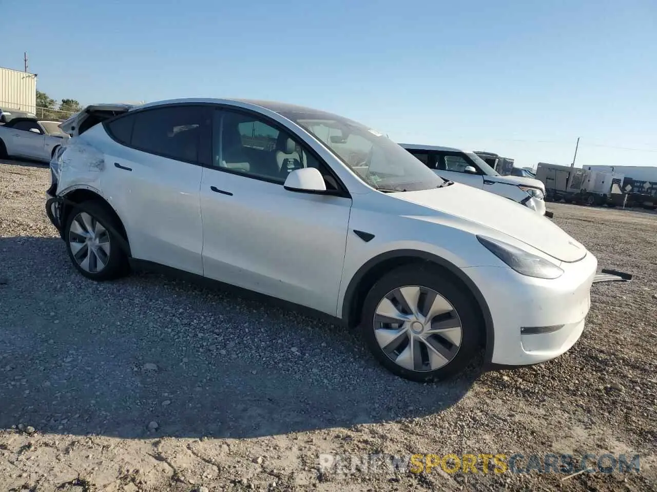 4 Photograph of a damaged car 7SAYGDEEXRA251147 TESLA MODEL Y 2024