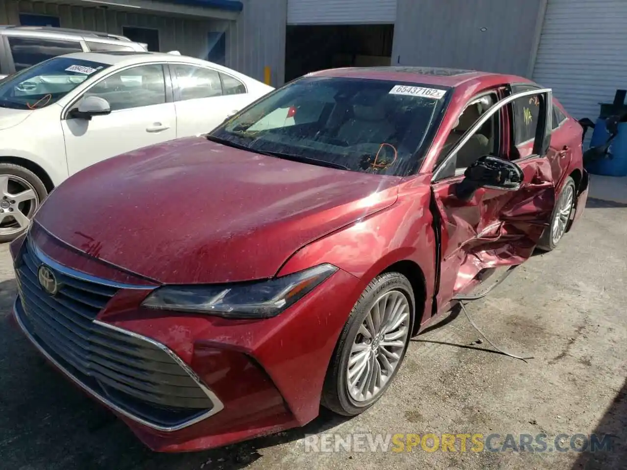 2 Photograph of a damaged car 4T1BZ1FB8KU023899 TOYOTA AVALON 2019