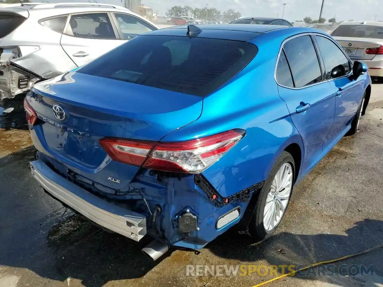 4 Photograph of a damaged car 4T1B11HK0KU261511 TOYOTA CAMRY 2019