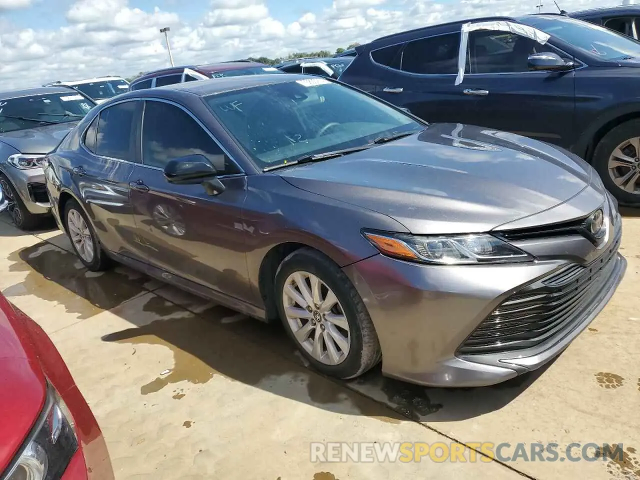 4 Photograph of a damaged car 4T1B11HK1KU679947 TOYOTA CAMRY 2019