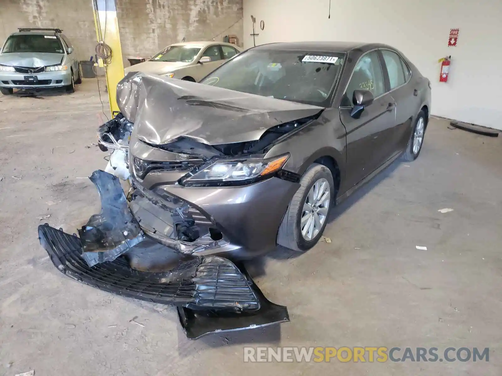 2 Photograph of a damaged car 4T1B11HK1KU702952 TOYOTA CAMRY 2019