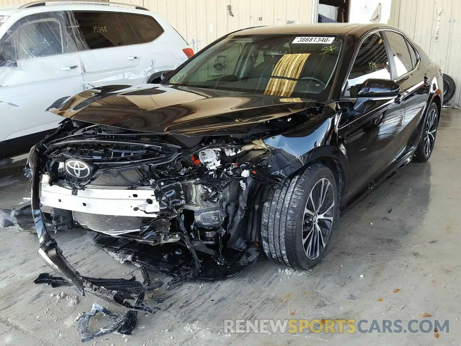 2 Photograph of a damaged car 4T1B11HK1KU708590 TOYOTA CAMRY 2019