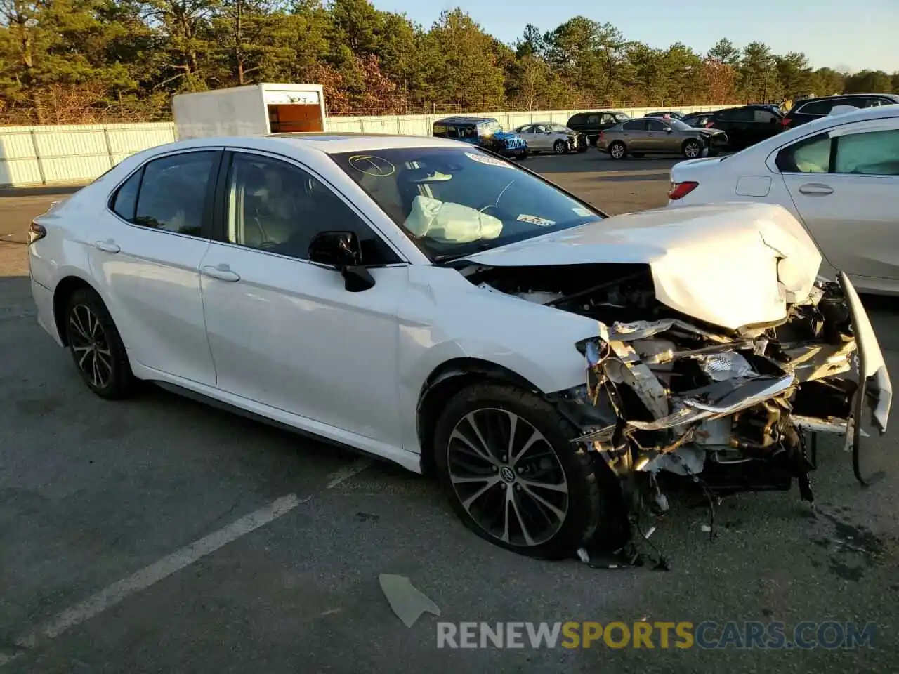 4 Photograph of a damaged car 4T1B11HK4KU283799 TOYOTA CAMRY 2019